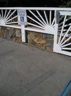 Skid marks, above, were visible at the scene of the accident where a woman with a baby in her arms was struck by a Jeep and pinned to the fence outside of Aqua Bistro in Coral Bay.