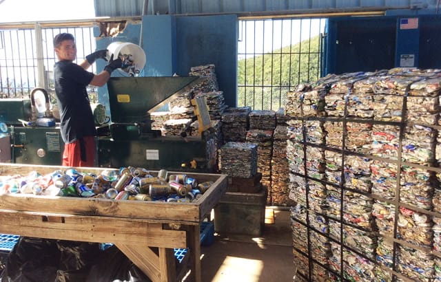 Anthony Novelli crushing cans | St. John Tradewinds News