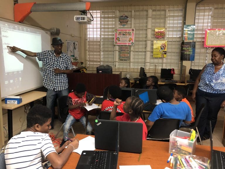 Boys of e-STEAM Carnival Troupe Get Intro to Coding