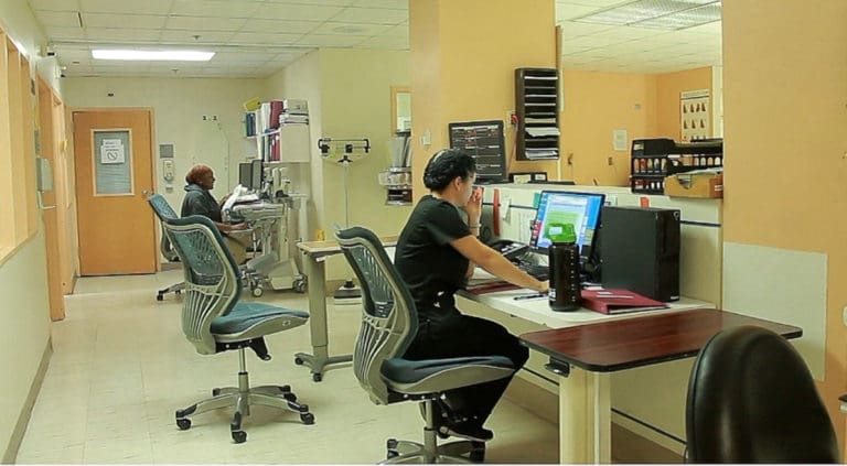 Staff nurses monitor the intensive care unit.