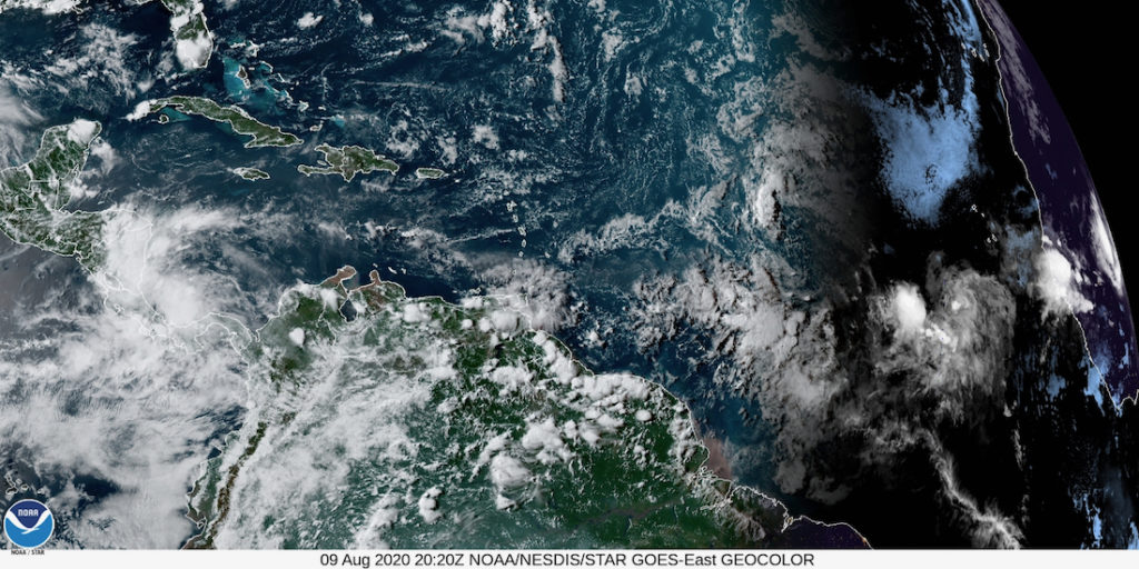 Sunday afternoon satellite photo shows Invest 95-L to the right, as it makes its way west towards the Caribbean. (NOAA satellite photo)