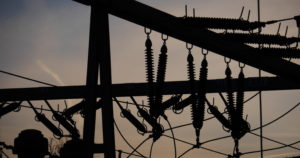 Electrical power grid in silhouette. (Shutterstock image)
