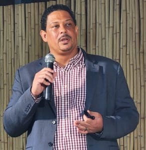 Department of Planning and Natural Resources Commissioner Jean-Pierre Oriol addresses the crowd, which at times numbered more than 200, at a town hall meeting Tuesday night to discuss the Hull Bay boat ramp project. (Source photo by Shaun Pennington)