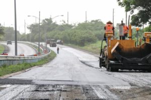 A Public Works crew in 2018 resurfaces a stretch of Melvin Evans Highway. (Source file photo)