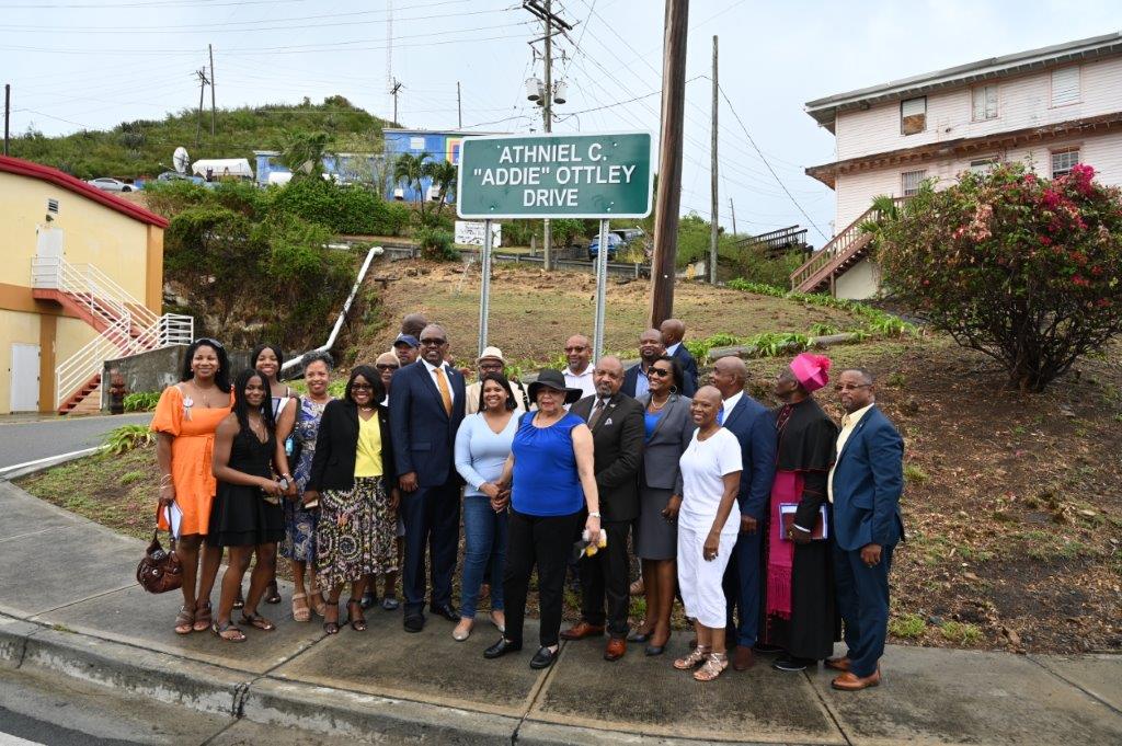 Family, friends and colleagues gather Thursday for the unveiling of the sign naming a stretch of road in Sub Base, St. Thomas, after the late Athniel C. "Addie" Ottley. (V.I. Legislature photo by Barry Leerdam)