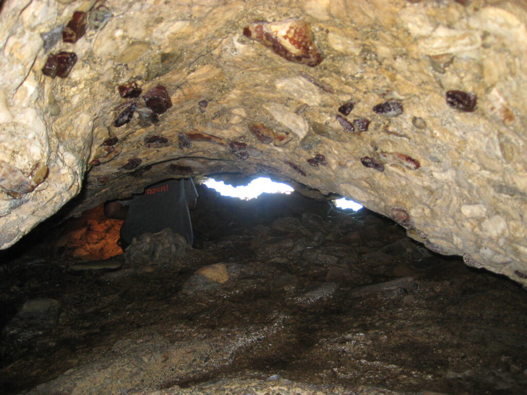 A hiker rests on his journey through a cave with two compartments in Maroon Country on St. Croix. (Photo by Olasee Davis)