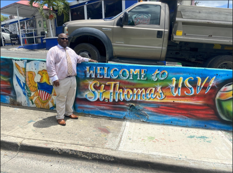 Photo Focus: St. Thomas Father and Son Paint Mural in Town