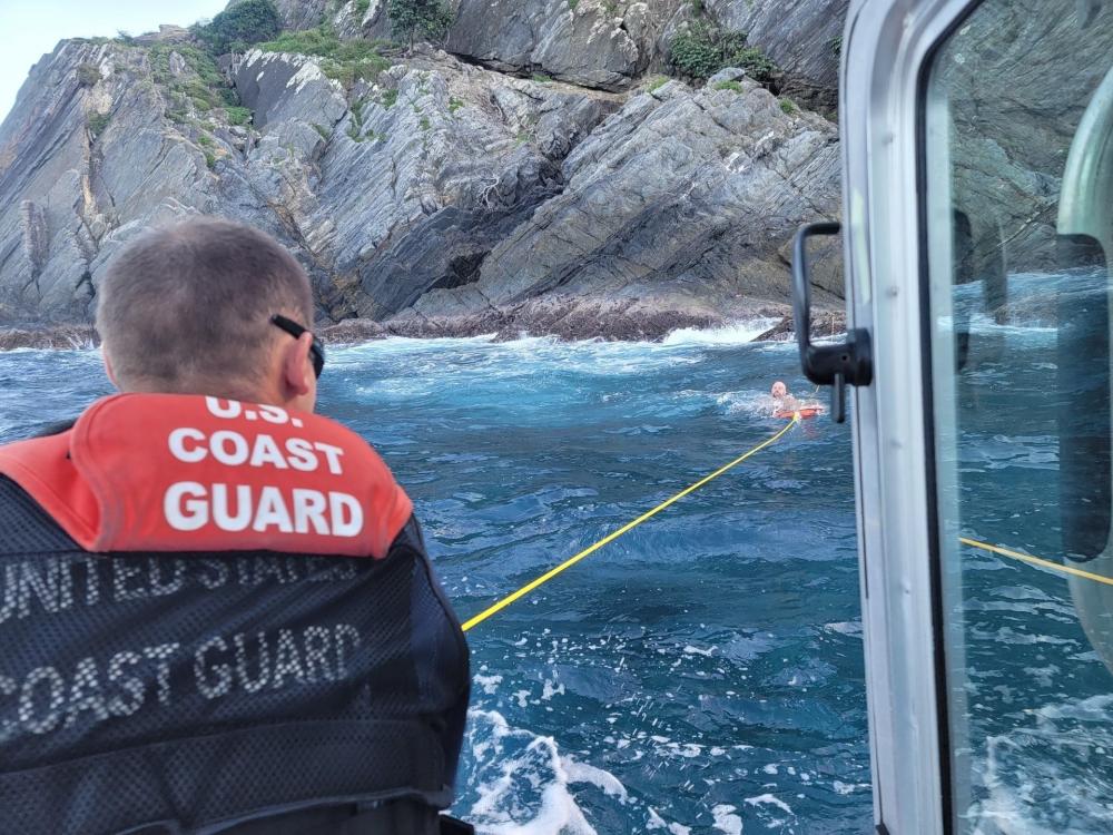 A Coast Guard crew from Boat Forces Detachment St. Croix rescues a missing snorkeler stranded on the rocks off the Hamm's Bluff Lighthouse on Tuesday on St. Croix. (U.S. Coast Guard photo)