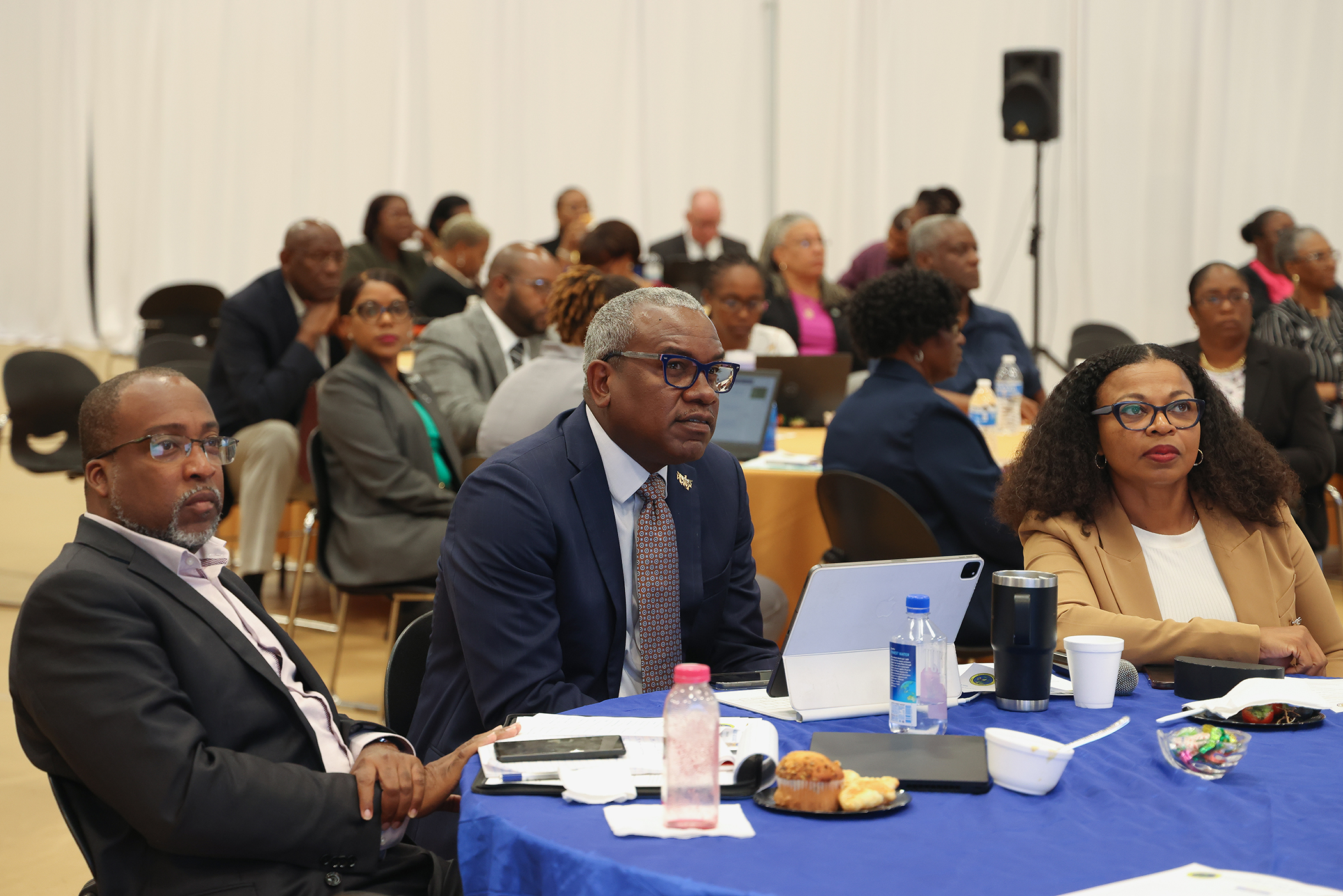 Chief of Staff Karl Knight, Governor Bryan and OMB Director Jenifer O’Neal watch a presentation at the 2023 Spring Revenue Estimating Conference. (Photo courtesy Government House)
