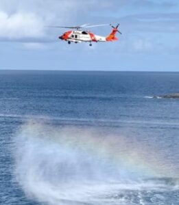 A Coast Guard helicopter crew searches for missing boater Todman Davaughn on Sunday. The search was called off at 2 p.m. Monday. (Coast Guard photo)