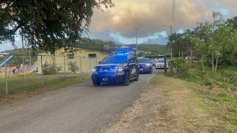 A V.I. Police Deparment escort leads the way to the motorcade. (Source photo by Diana Dias)