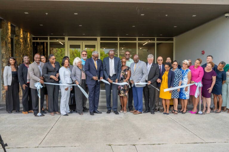 Dignitaries and invited guests, including Gov. Albert Bryan, Jr. and David Hall (center left and center right, respectively) gathered for a ribbon-cutting ceremony at the Orville E. Kean Campus in St. Thomas on Tuesday. (Submitted photo)