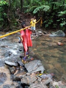 As we got close to the river, we hiked down into steps and walked across the river holding a rope to get us on the other side. (Photo by Olasee Davis)