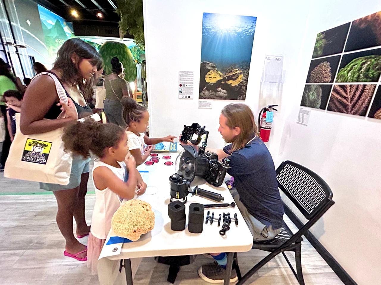 Dan Male speaks with children at the V.I. Children's Museum's Day of Play event. (Photo courtesy VICM)