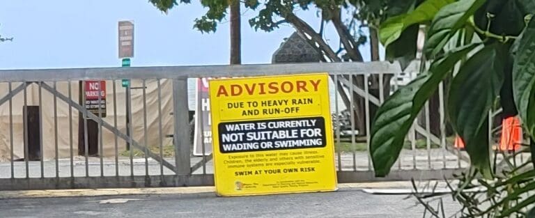 The gates to Magens Bay Beach on St. Thomas remained closed Friday after more than a week of heavy rain, with a sign warning that the water is not suitable for wading or swimming. (Submitted photo)