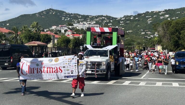 The fifth annual Liston Davis Children’s Parade passes Yacht Haven Grande on its way to the V.I. Children’s Museum. (Source photo by Siân Cobb)