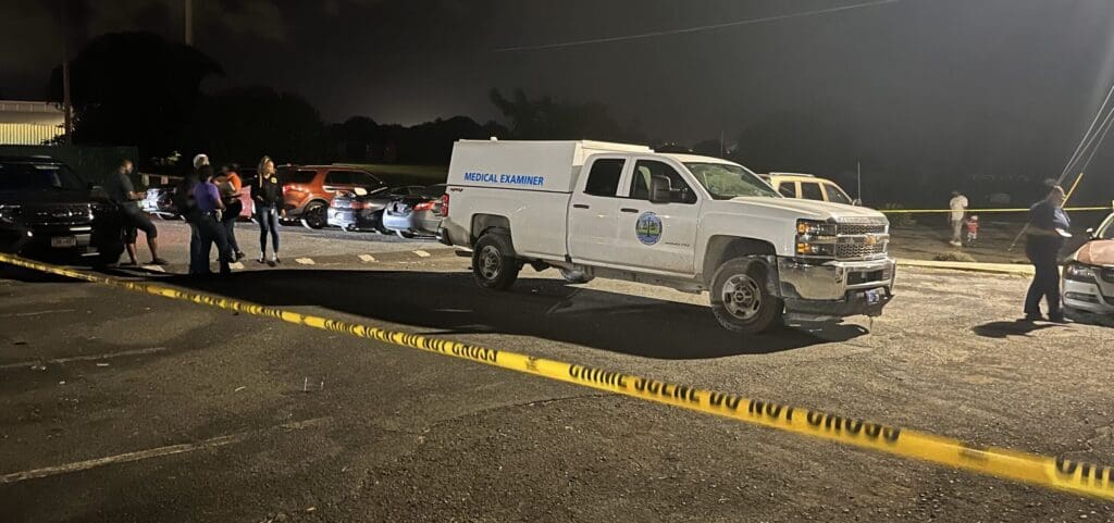 Police and the Medical Examiner's Office investigate at the scene of a shooting Sunday as officers responded to reports of a domestic violence incident at Lorraine Village on St. Croix. (Photo courtesy VIPD)