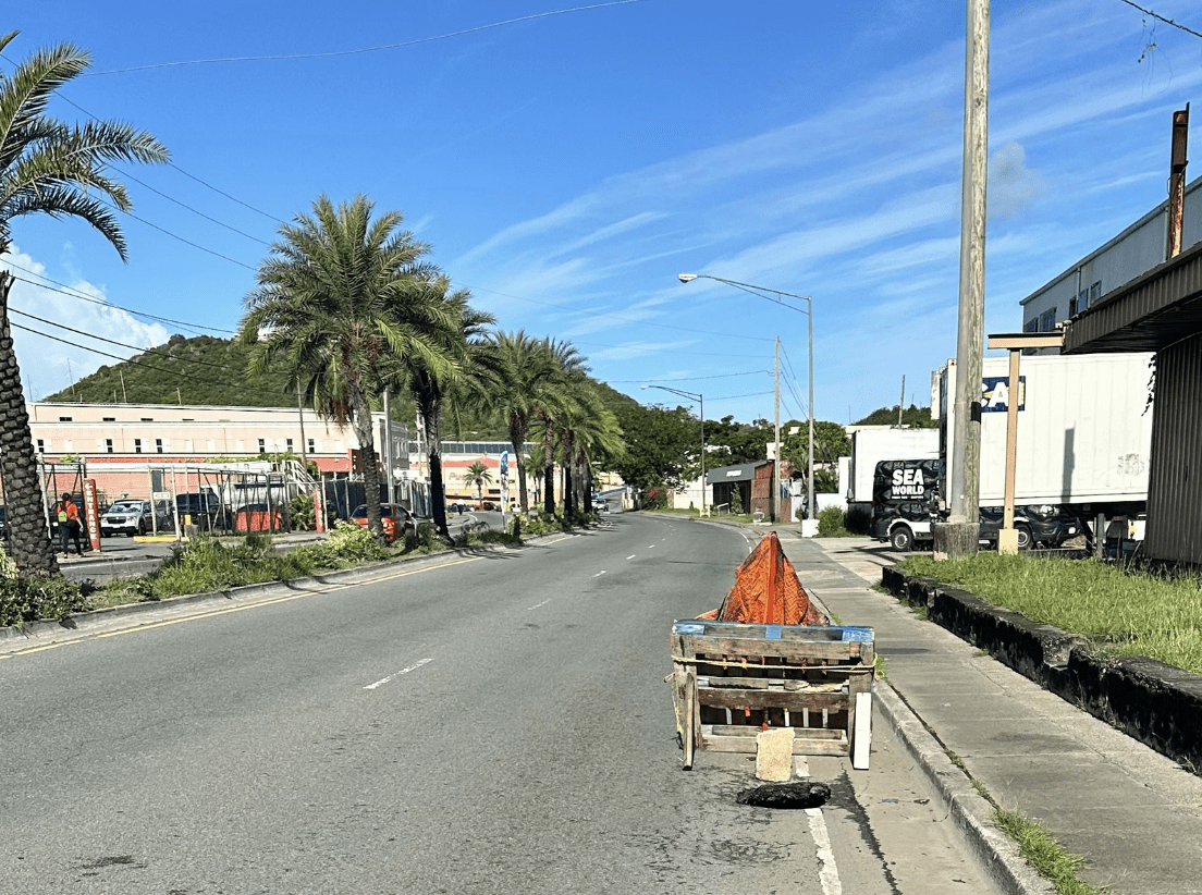 a sinkhole has developed in the far-left eastbound lane of the Moravian Highway on St. Thomas, between Turnbull’s Funeral Home and Gottlieb Gas Station. (Photo courtesy DPW)