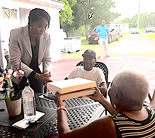 Plaskett Presents U.S. Flag to Raymond Williams and Family
