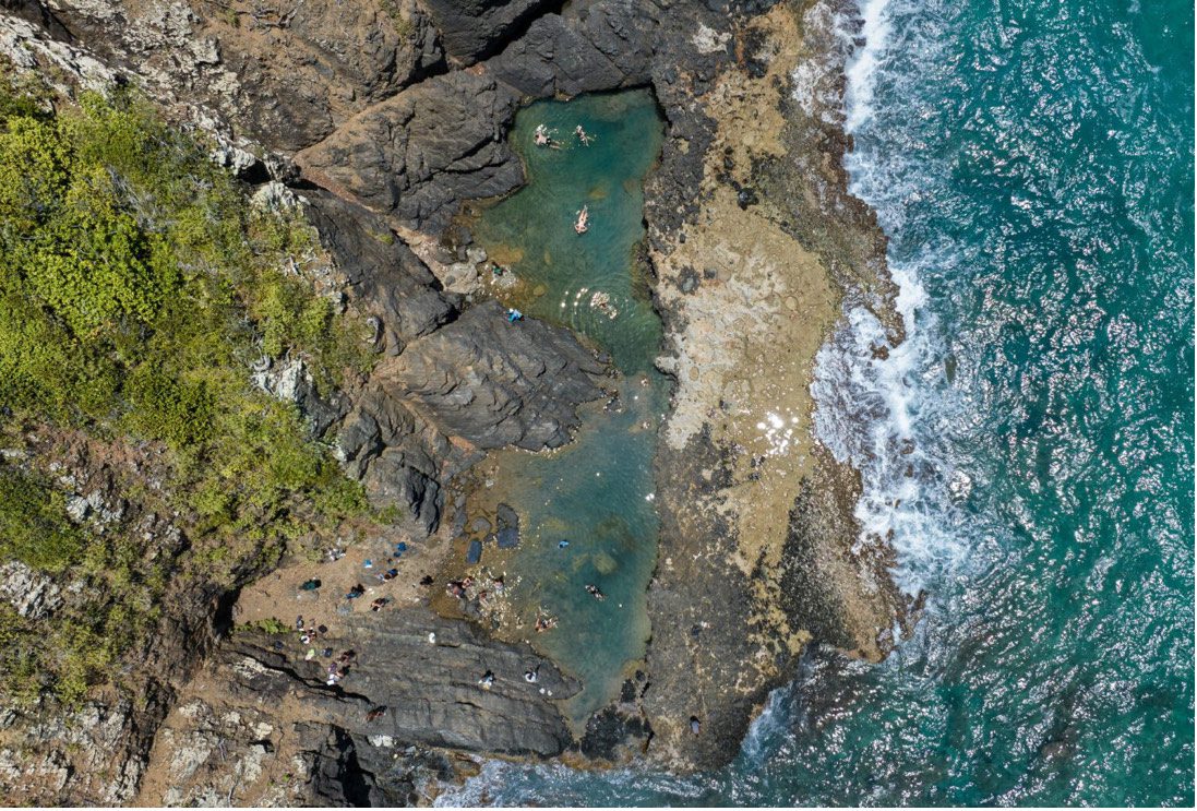 Hikers relax in a tide pool that is part of the new Maroon Sanctuary Territorial Park in remote northwest St. Croix. (Photo courtesy DPNR)