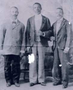 Our grandfather John C. Davis Sr. (Davies), standing on the left with his two friends, in an old family photo taken in the 1930s on St. Thomas.