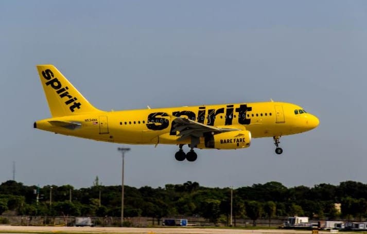 A Spirit Airlines jet flies over the tarmac. (Source file photo)