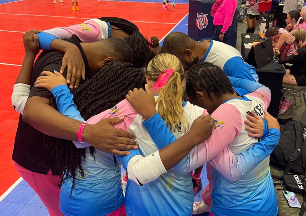 Island Mixx 12U huddle for a team prayer before their match Wednesday at the 2026 AAU National Volleyball Championships. (Photo by Shanique Woods Boschulte)