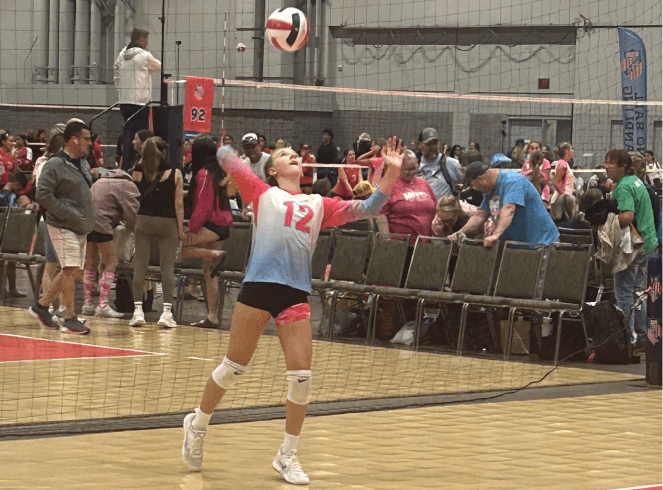 Scarlett Poss (Island Mixx 13U) serves the ball during their match against Dunes 13 Teal. (Photo by Mark Daniel)